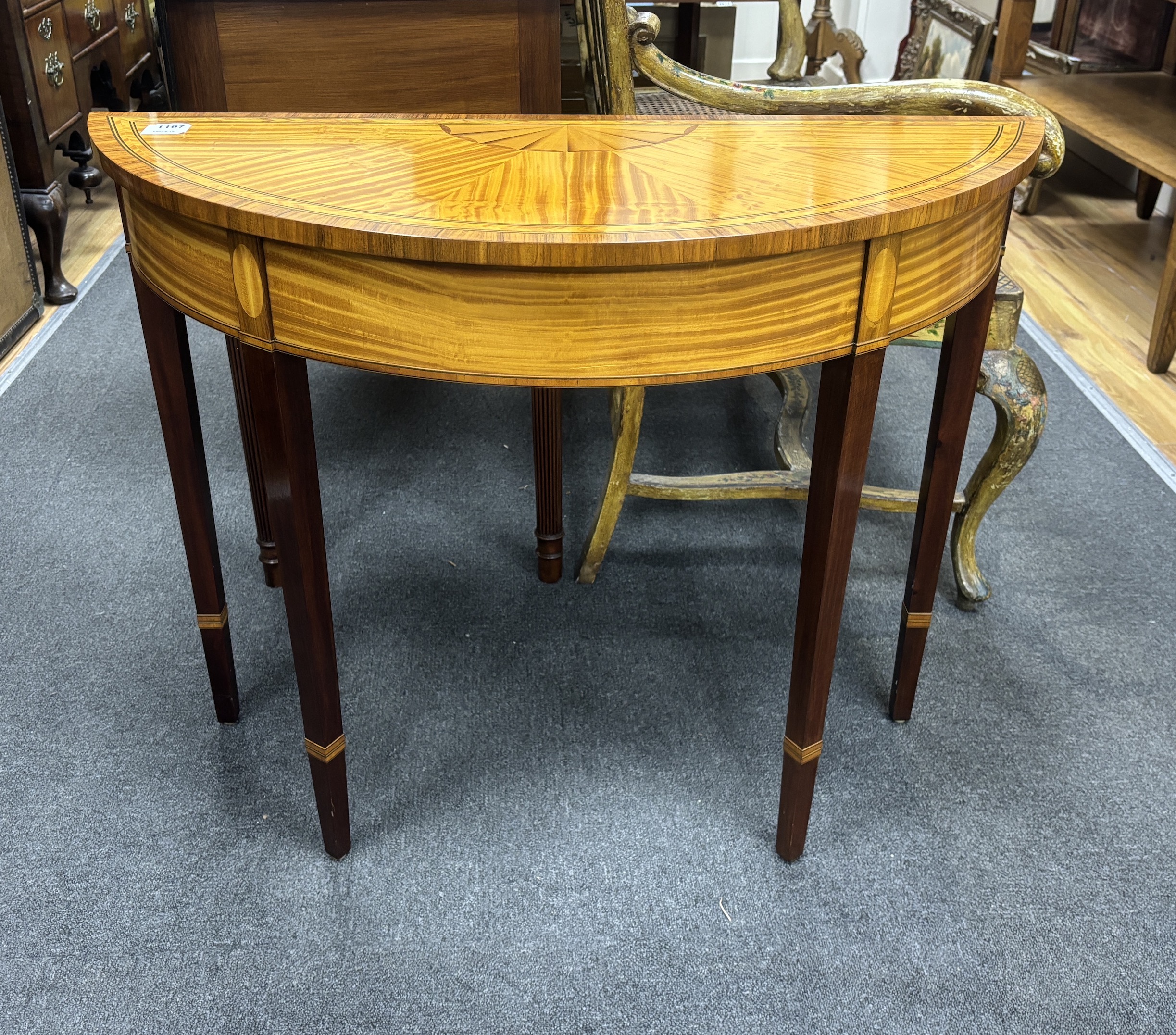 A pair of reproduction Sheraton style banded satinwood D shaped side tables, width 94cm, depth 39cm, height 73cm